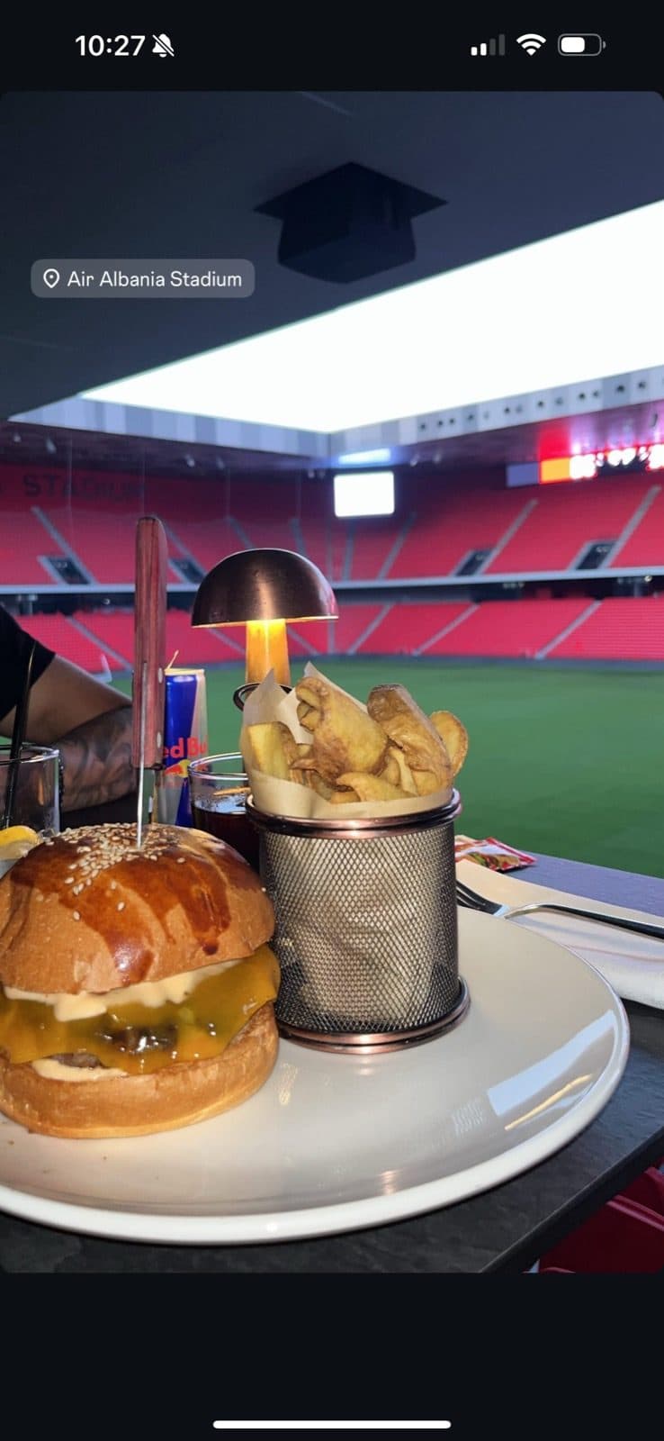 Guest photo of the Arena burger with the pitch behind