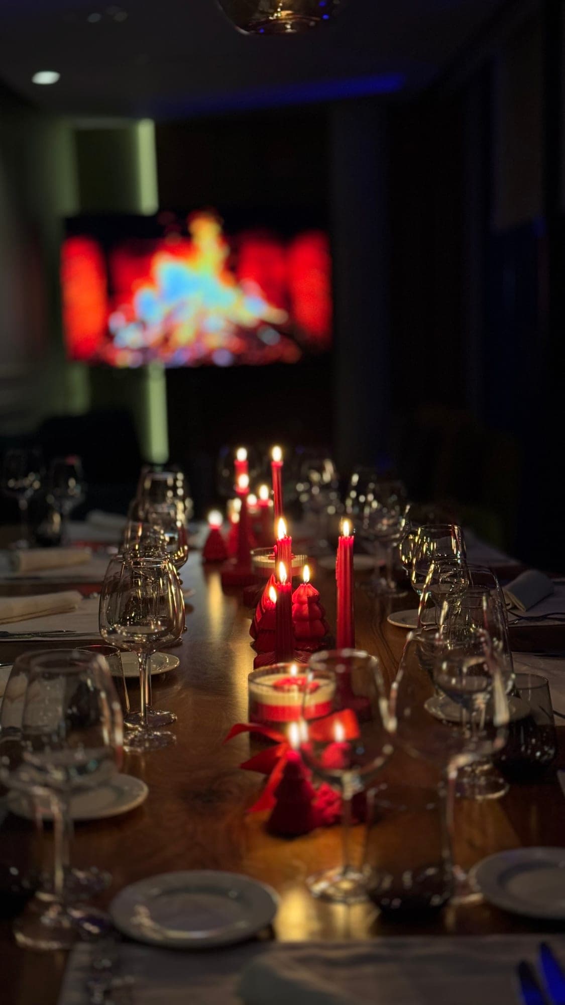 A candlelit table set for an evening event
