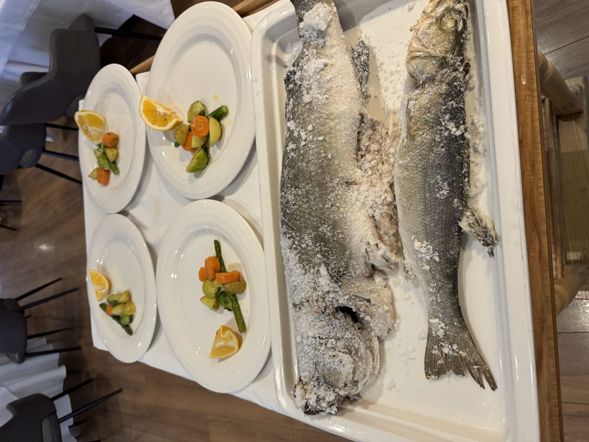 Whole fish finished in a salt crust, tableside service